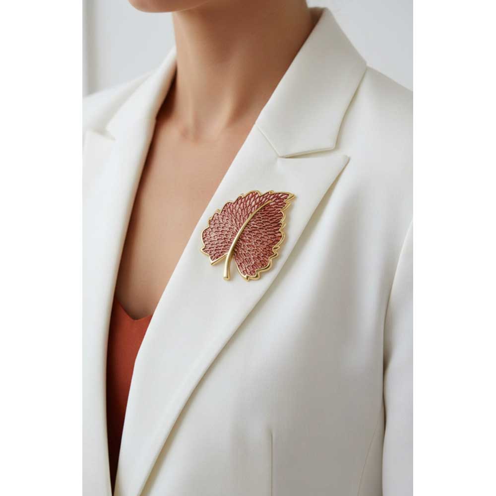 Model wearing burgundy lace leaf pin on a white jacket - Lilylin Designs