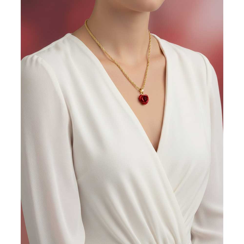 Model wearing dainty red rose pendant on a gold chain with a white dress - Lilylin Designs