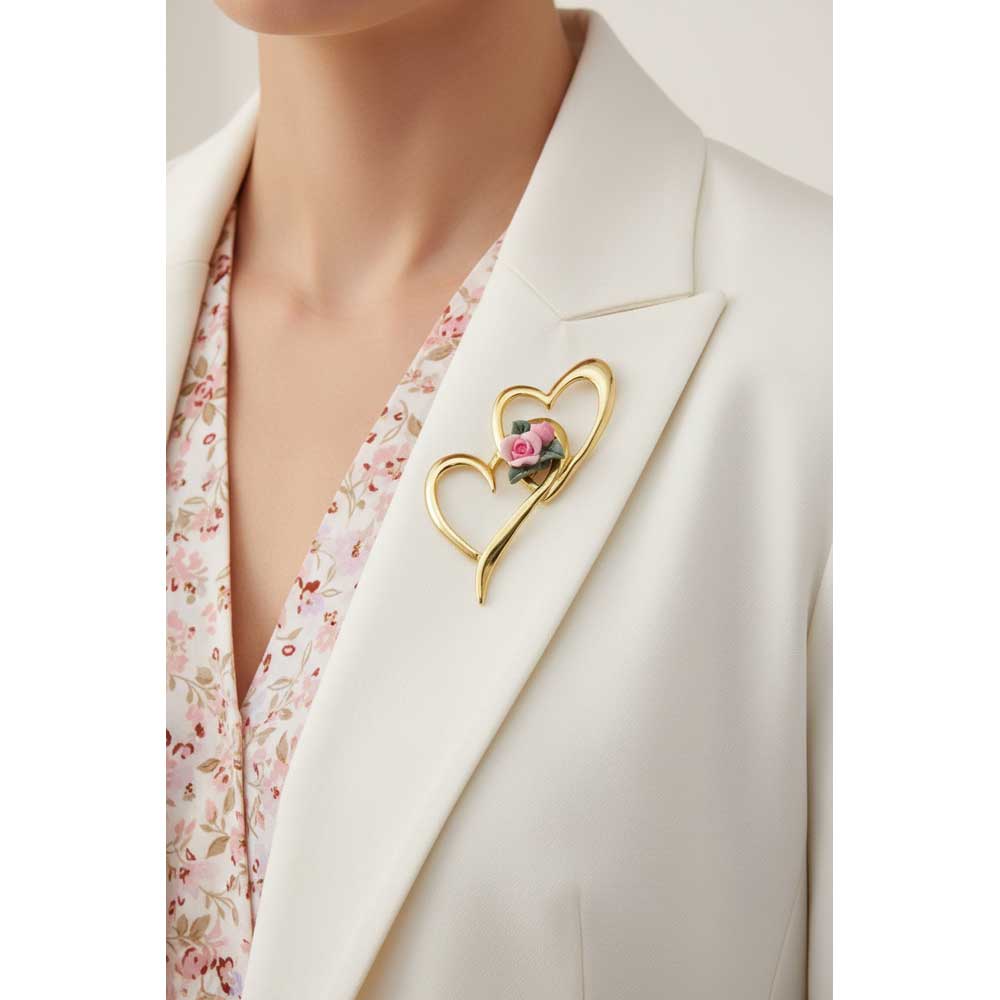 Model wearing double gold heart with pink clay rose pin on a white jacket - Lilylin Designs