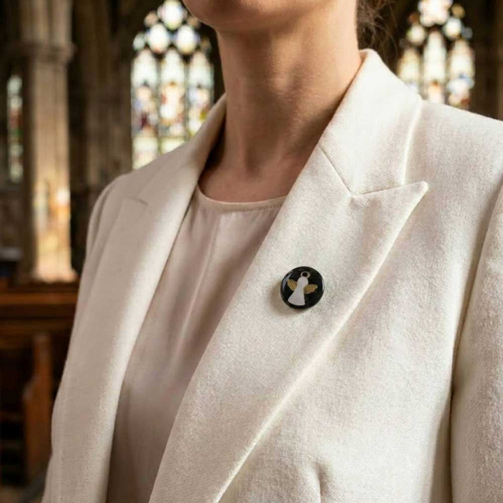 Model wearing little angel resin tac pin on white jacket - Lilylin Designs