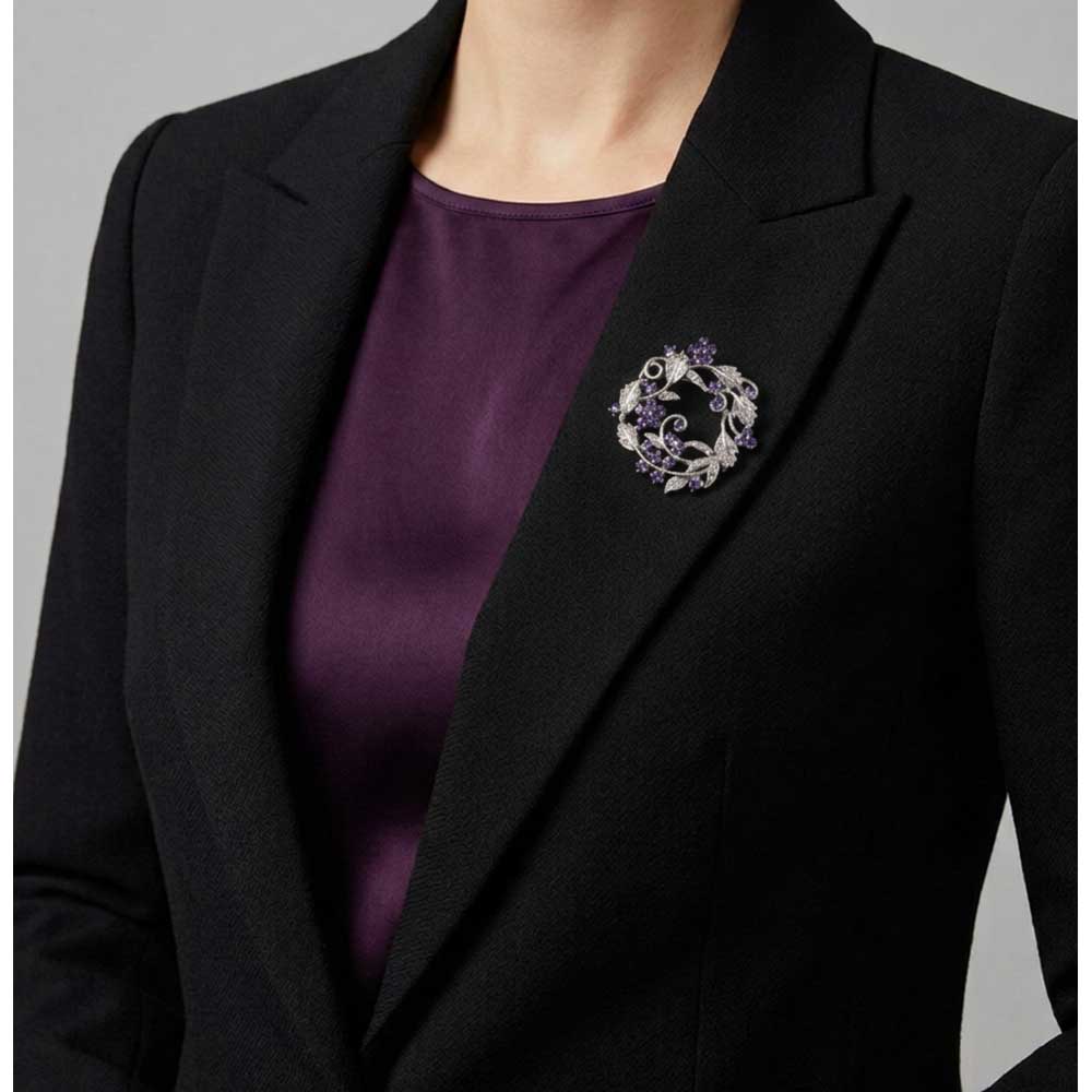 Model wearing Purple Crystal Daisies Flower Wreath Brooch Pin on a black jacket with a purple top - Lilylin Designs