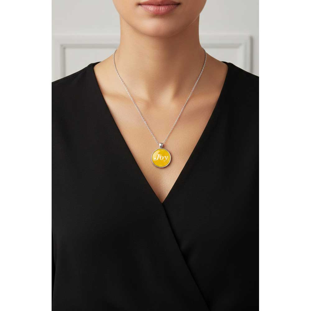 Model wearing Lilylin Designs yellow with white "Joy" necklace with a black dress