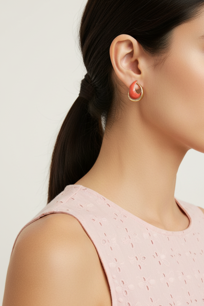 Model wearing orange and gold open teardrop earring - Lilylin Designs