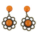 Pair of earrings with orange round resin and floral daisy bronze frames on a white background - Lilylin Designs