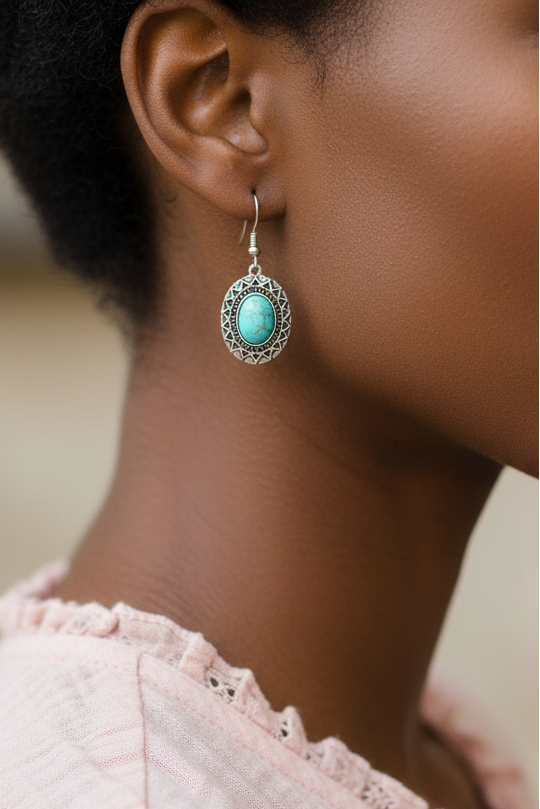 Model wearing oval turquoise dangle earring - Lilylin Designs