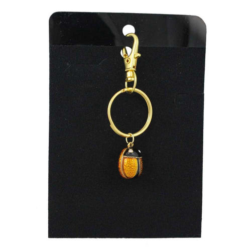 Gold keychain with a small brown ladybug charm on a black card - Lilylin Designs