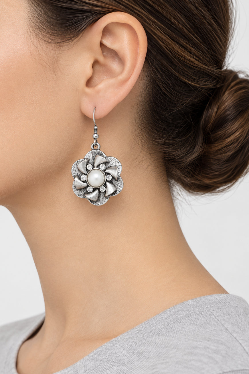 Model wearing flower with white pearl and crystal dangling earring - Lilylin Designs