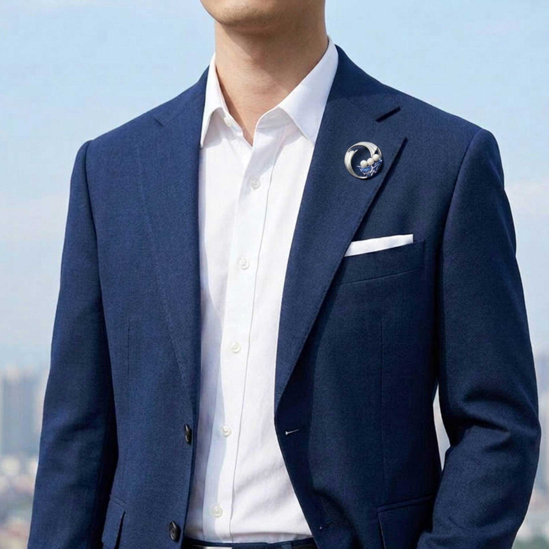 Man wearing pearl pin with wave design on a blue suit - Lilylin Designs