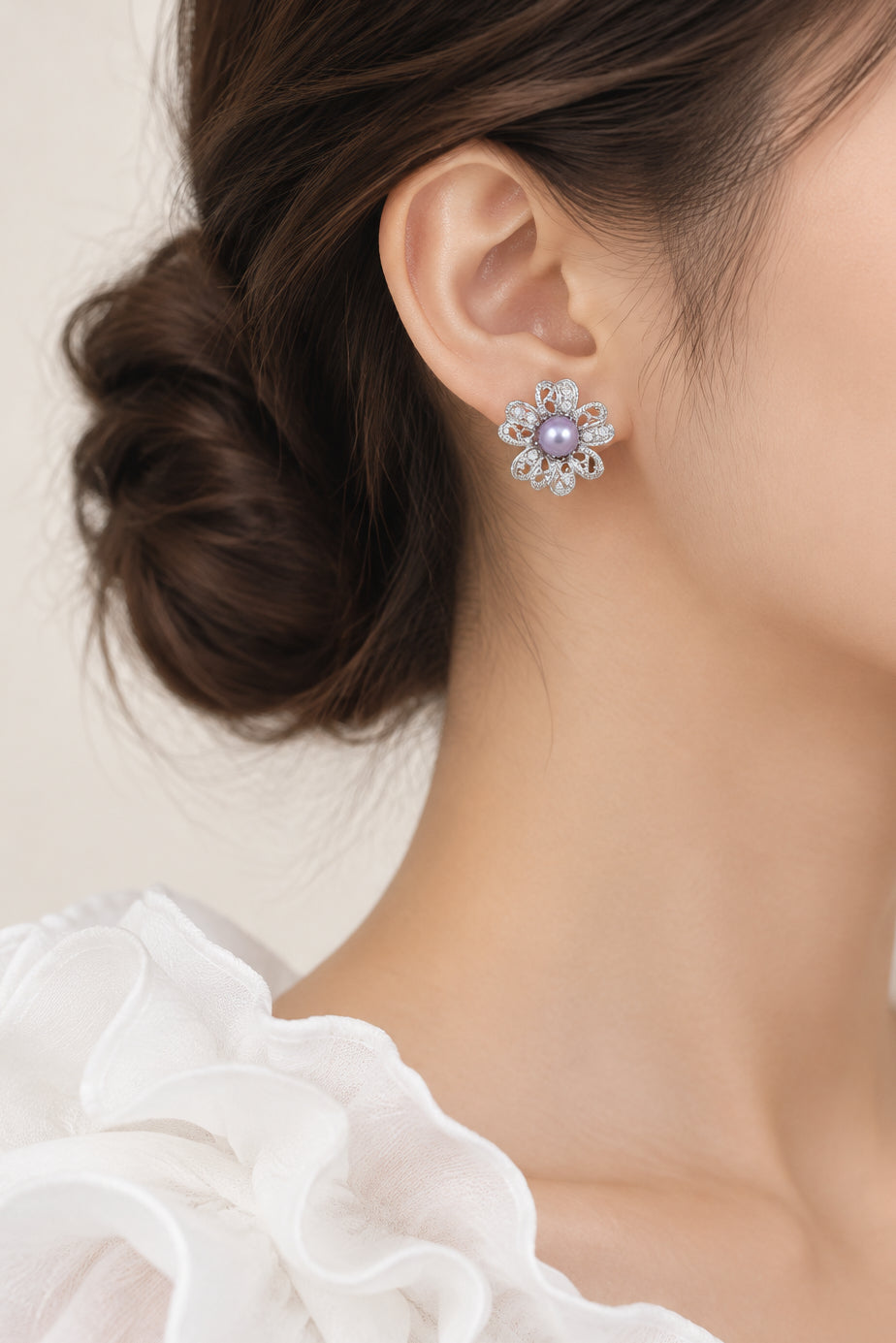 Model wearing crystal flower with purple pearl pierced earring - Lilylin Designs