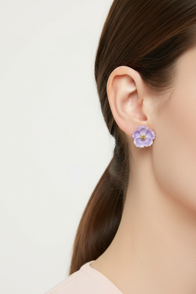 Model wearing a lavender flower stud earring with a gold center - Lilylin Designs