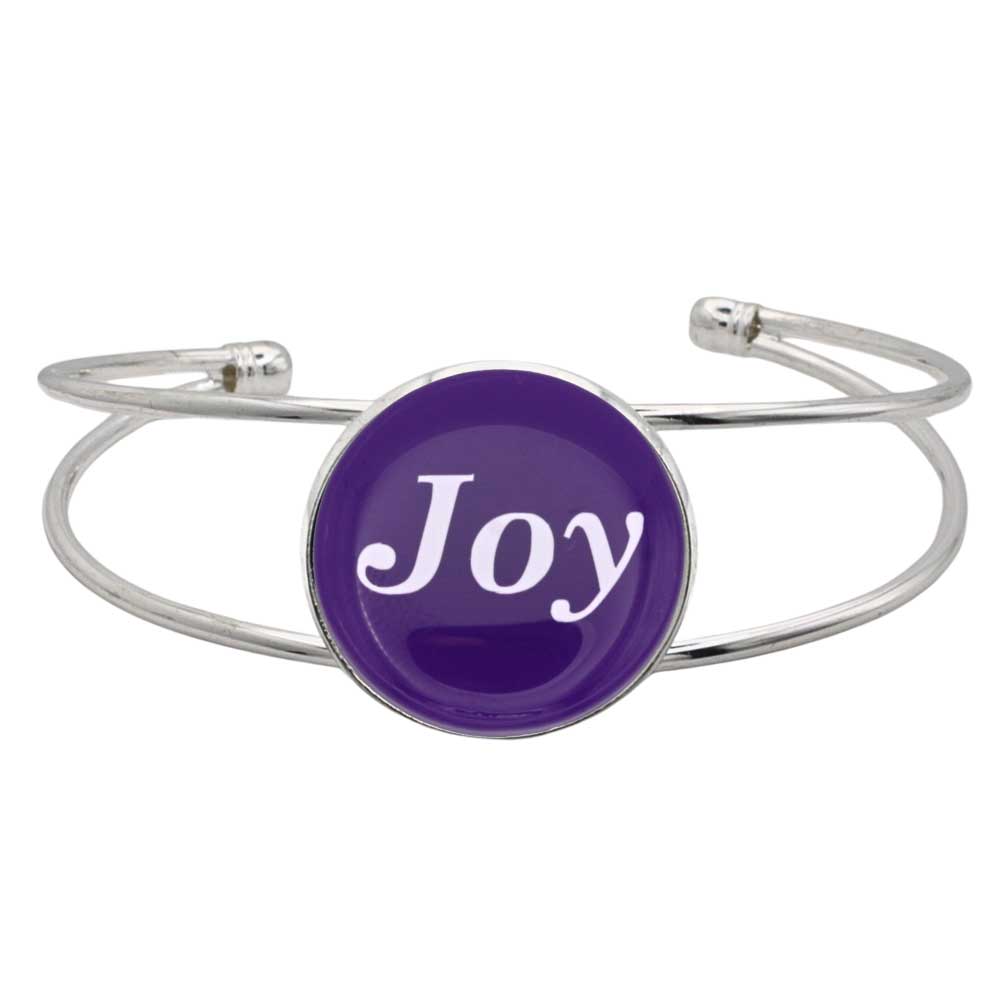 A silver-toned metal cuff bangle bracelet featuring a round purple disc with the word 'Joy' written in white script, set against a plain white background - Lilylin Designs