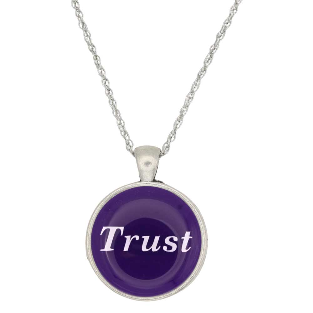 A silver chain necklace with a round pendant featuring a deep purple background and the word 'Trust' written in white script, set against a plain white background - Lilylin Designs