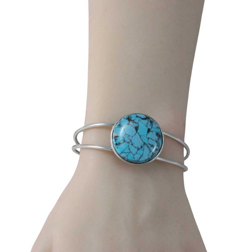 Turquoise stone bracelet on a wrist against a white background - Lilylin Designs