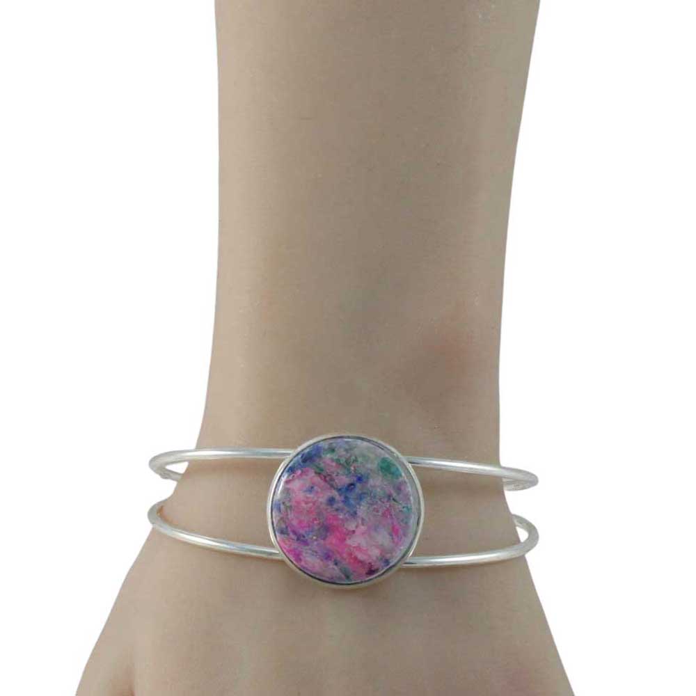 Model wearing Silver cuff bracelet with pink handcrafted clay stone on white background | Lilylin Designs