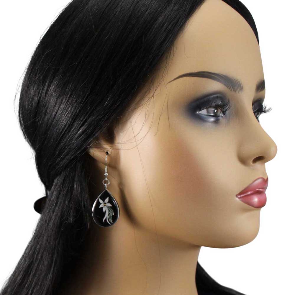 Model with Teardrop-shaped earrings with black background and white floral design - Lilylin Designs