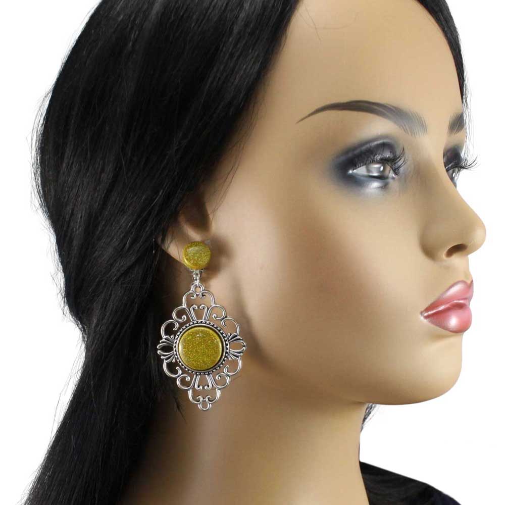 Model wearing a gold glitter earring with intricate silver design - Lilylin Designs