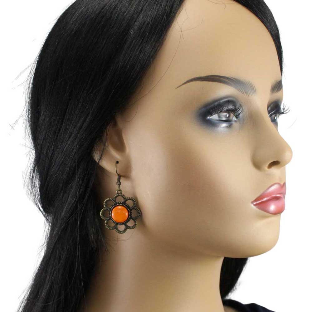 Model wearing a pair of earrings with orange center and bronze floral design - Lilylin Designs