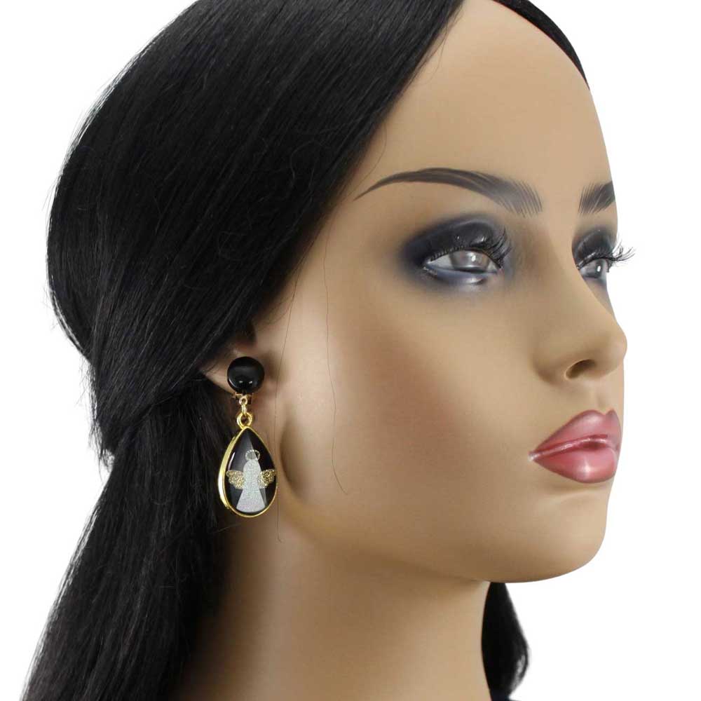 Model wearing black and gold angel clip earrings on a white background - Lilylin Designs