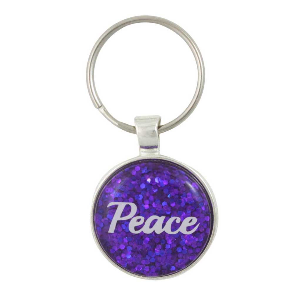 Keychain with purple glittery surface and 'Peace' text on a white background - Lilylin Designs