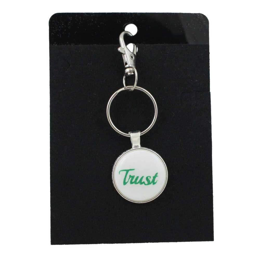Keychain with 'Trust' on a white background, displayed on a black card - Lilylin Designs