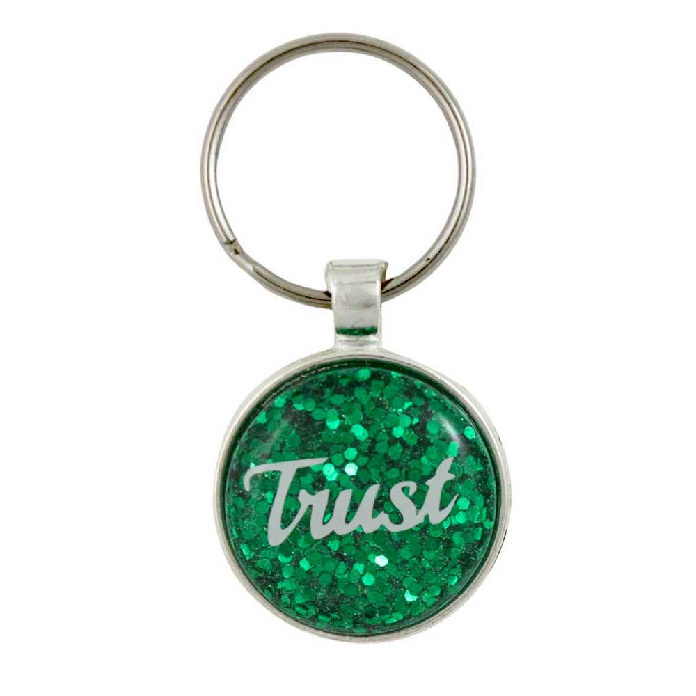 Keychain with green glittery surface and 'Trust' text on a white background - Lilylin Designs