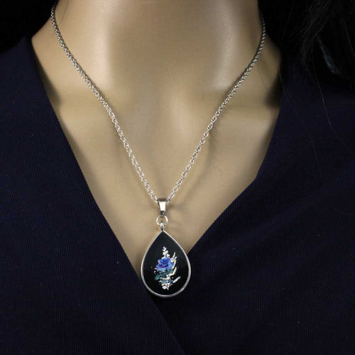 Model with Teardrop-shaped pendant with blue rose on a white background - Lilylin Designs