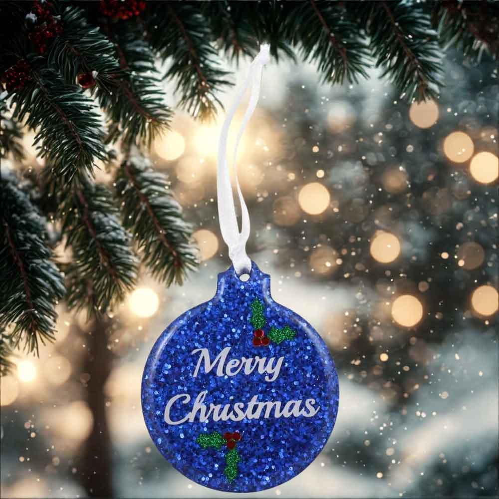Blue glittery Christmas ornament with 'Merry Christmas' text hanging on a tree branch | Lilylin Designs