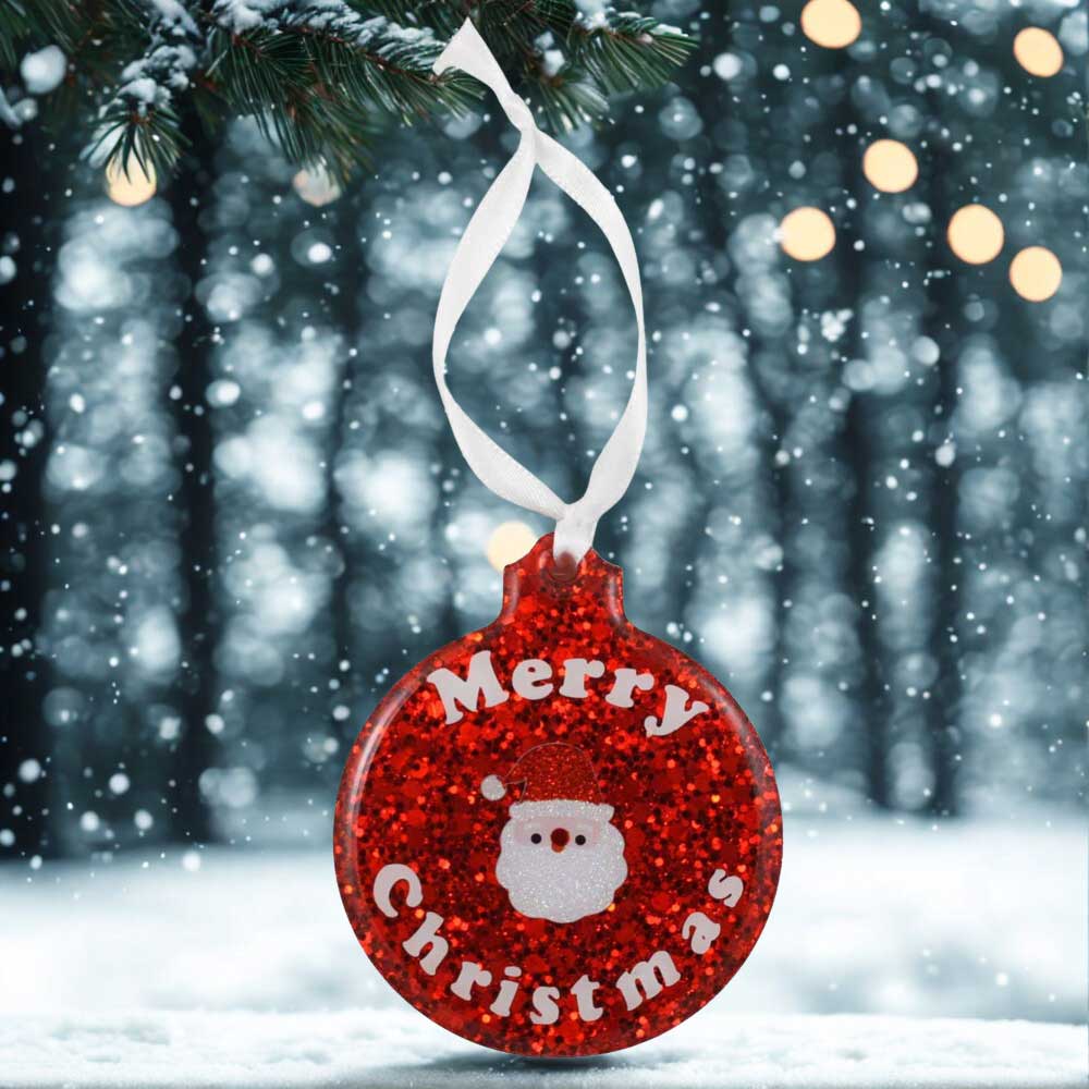 Red glittery Christmas ornament with 'Merry Christmas' text and Santa Claus face, hanging on a tree | Lilylin Designs