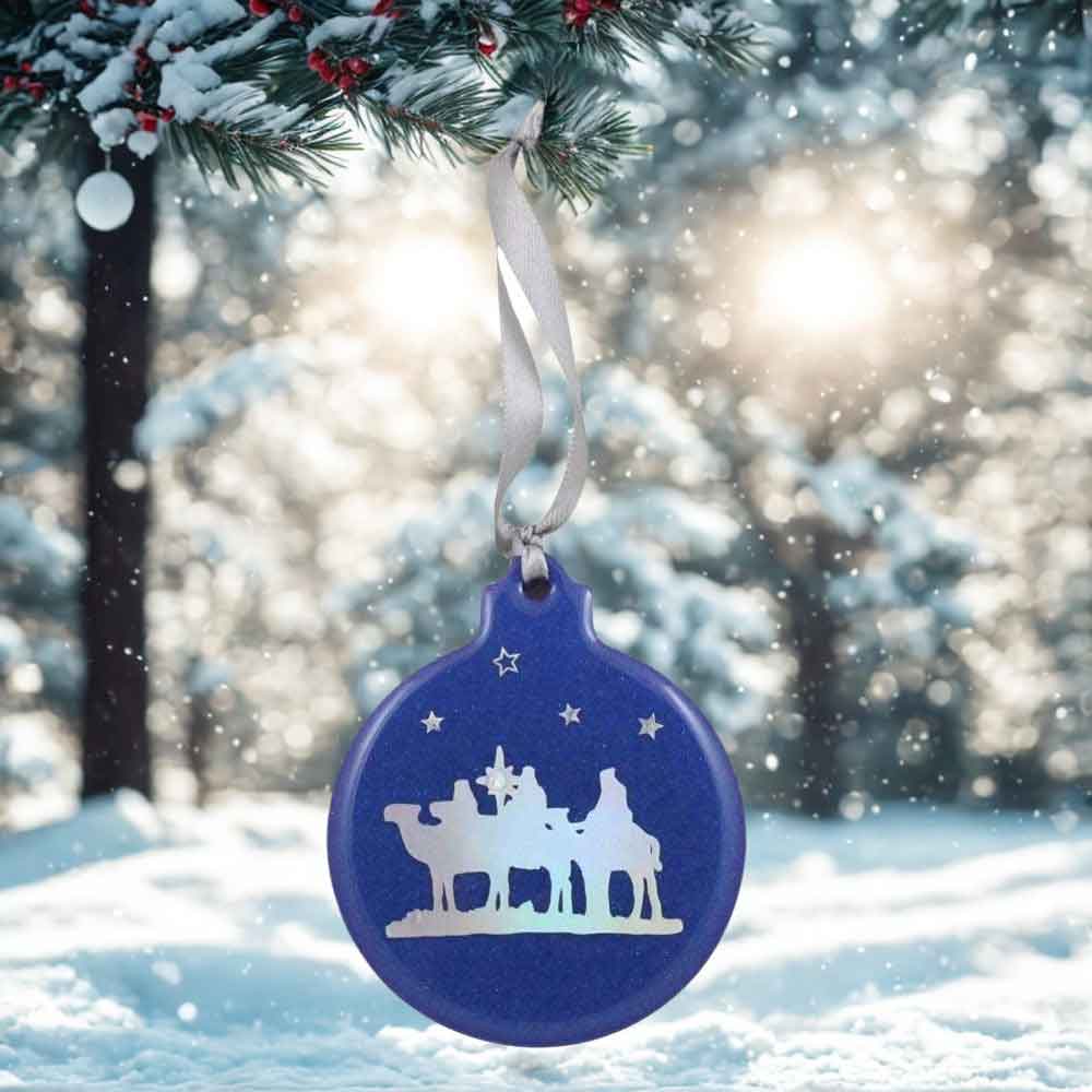 Blue Christmas ornament with white silhouette of three wise men on a snowy background | Lilylin Designs