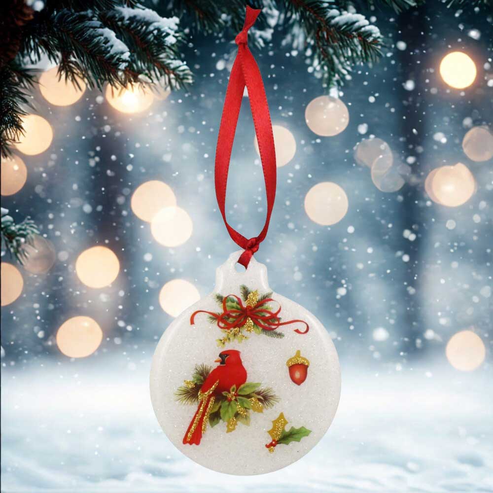 Decorative Christmas ornament with a red cardinal bird on a snowy background | Lilylin Designs