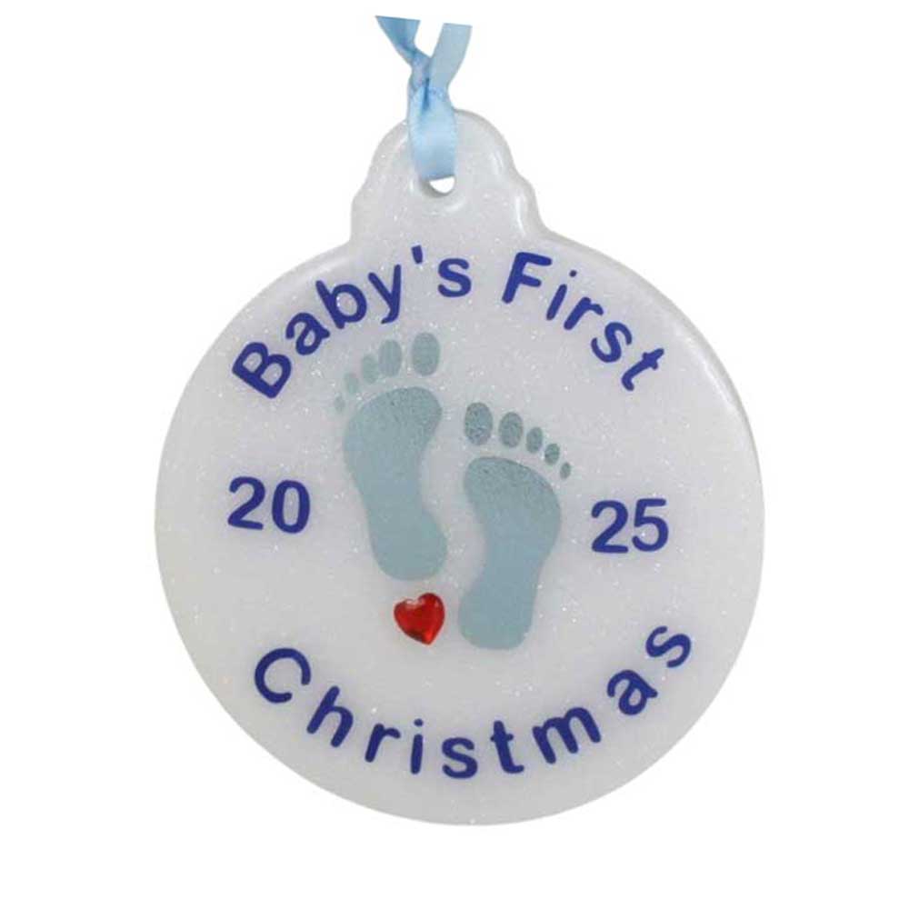 Decorative ornament for 'Baby's First Christmas' with blue footprints and a heart on a white background. | Lilylin Designs