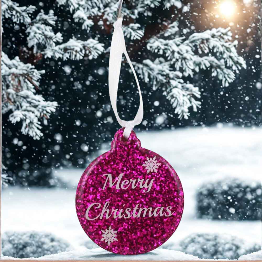 Pink glittery Christmas ornament with 'Merry Christmas' text against a snowy background | Lilylin Designs