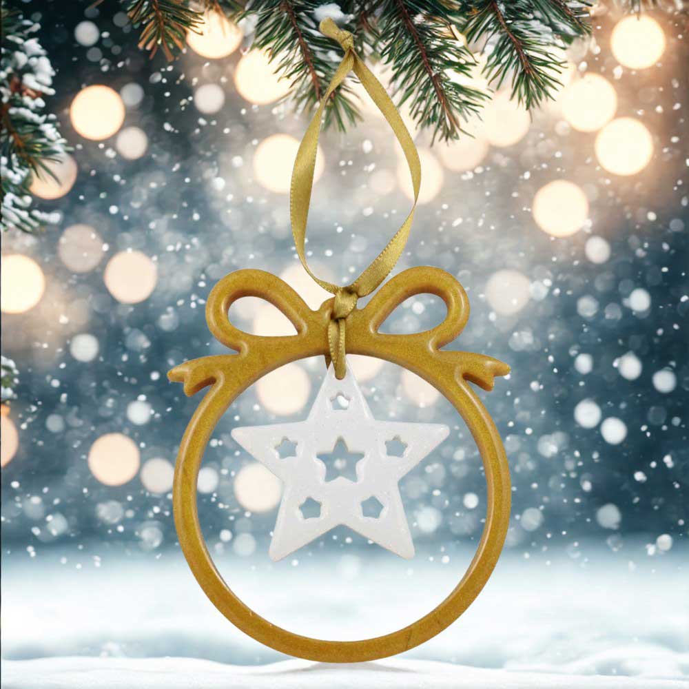 Gold colored open bow with white star resin ornament with snowy background | Lilylin Designs