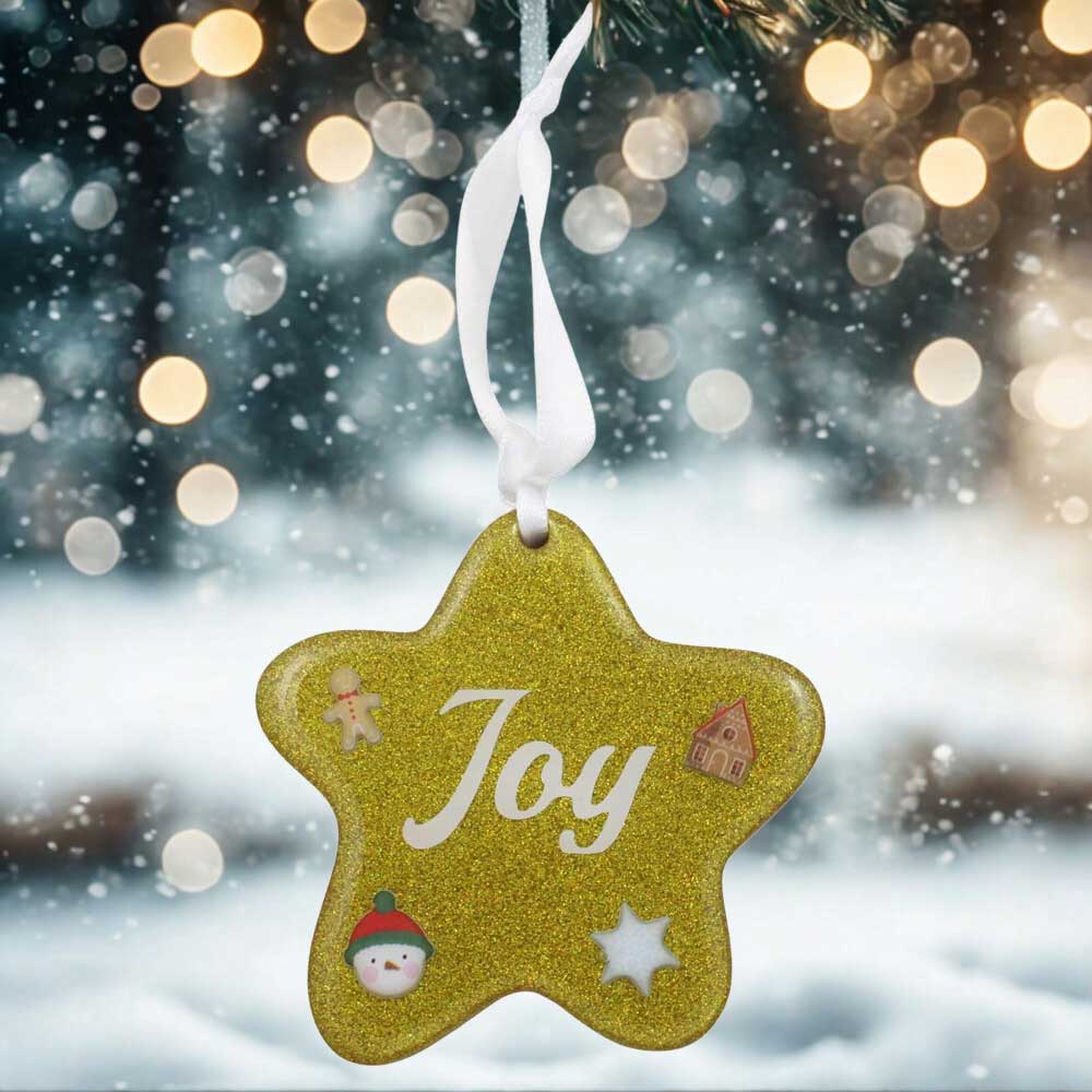 Gold star ornament with joy in white lettering with snowy background | Lilylin Designs