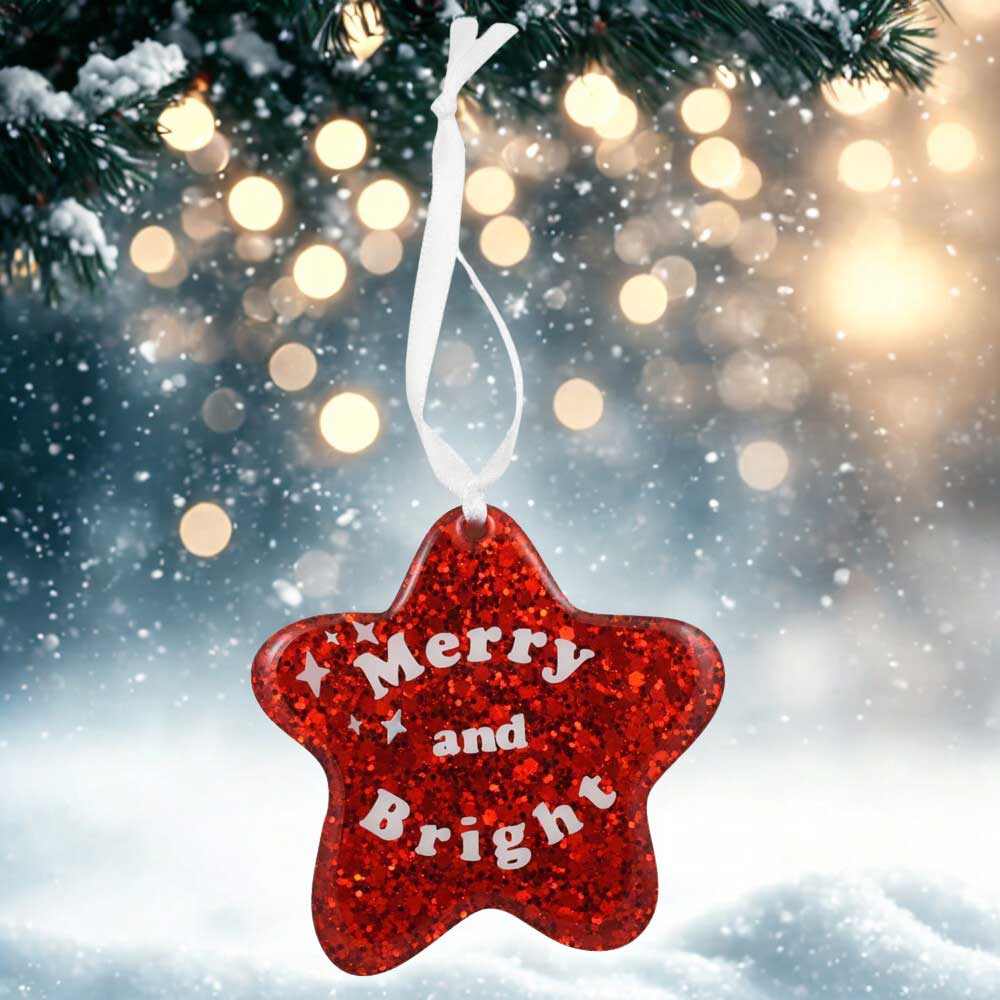 Red star ornament with "Merry and Bright" in white lettering on a snowy background | Lilylin Designs