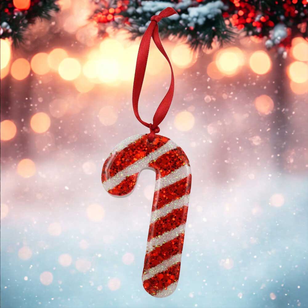 Red and white striped candy cane ornament with a red ribbon against a festive background.| Lilylin Designs