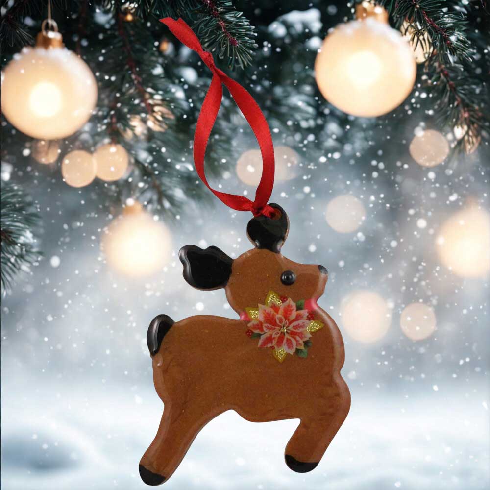 Deer ornament with a poinsettia flower on a festive background | Lilylin Designs