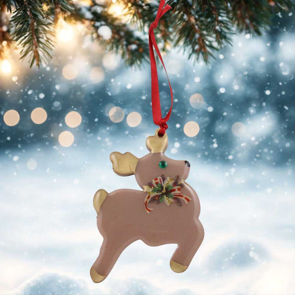Decorative reindeer ornament with a red bow on a festive background | Lilylin Designs