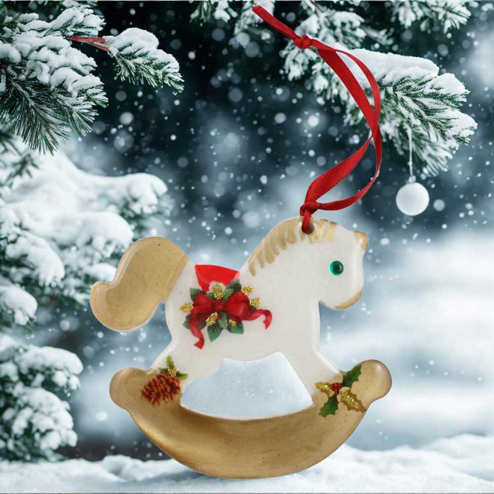 Decorative rocking horse ornament with gold accents on a snowy background | Lilylin Designs