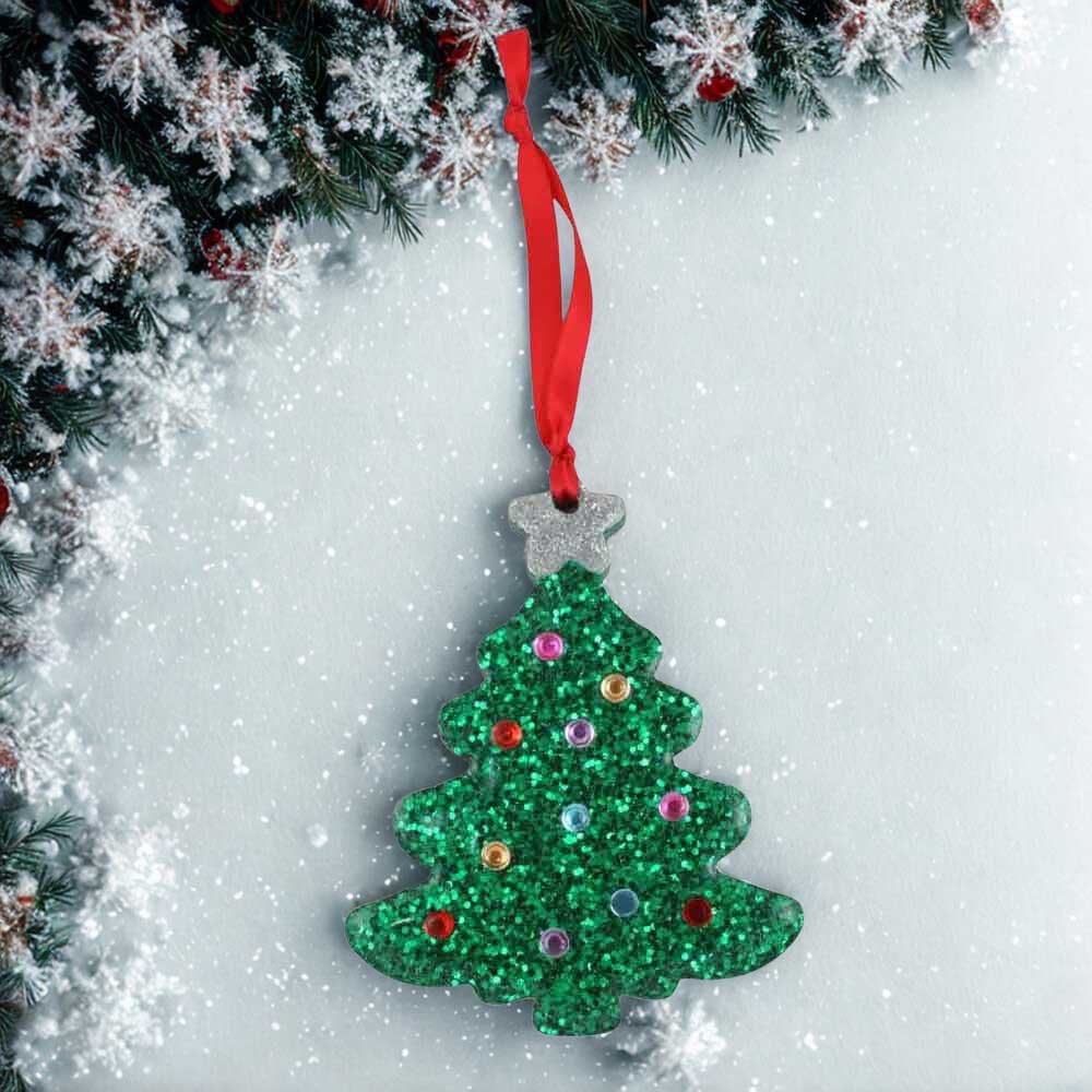 Green glittery Christmas tree ornament with colorful ornaments on a snowy background | Lilylin Designs