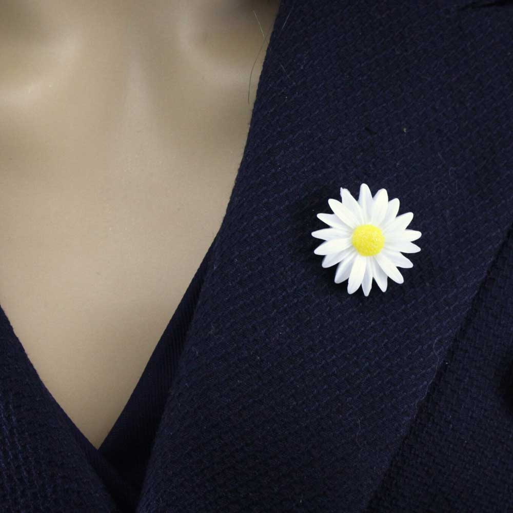 Daisy flower lapel pin on a dark blue blazer - Lilylin Designs