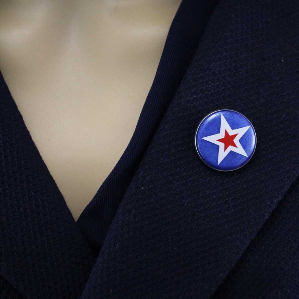 Model wearing Round blue with white and red stars patriotic lapel pin - Lilylin Designs