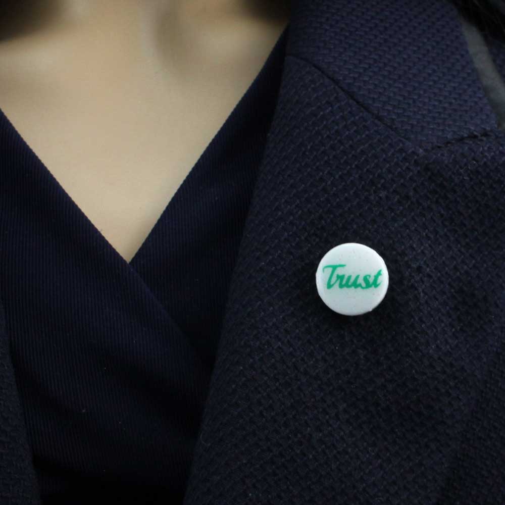 Small White Disc with Green Trust Lapel Pin - Lilylin Designs