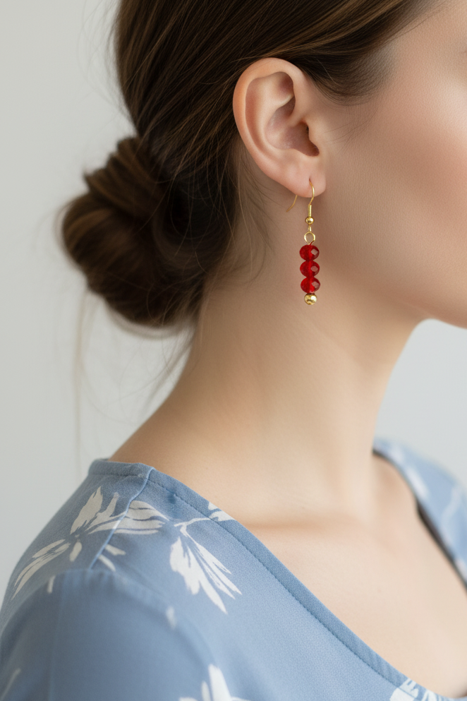 Model wearing red faceted bead earring - Lilylin Designs