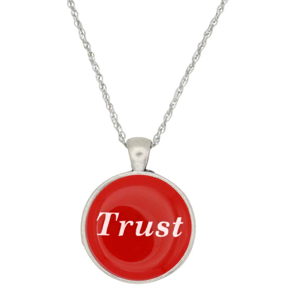 A silver chain necklace with a round pendant featuring a vibrant red background and the word 'Trust' written in white script, set against a plain white background - Lilylin Designs