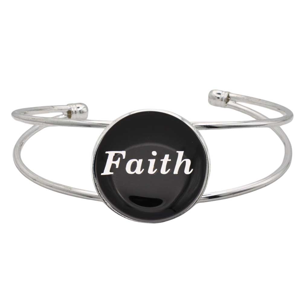 A silver-toned metal cuff bracelet featuring a round black disc with the word 'Faith' printed in white script, shown on a plain white background – Lilylin Designs