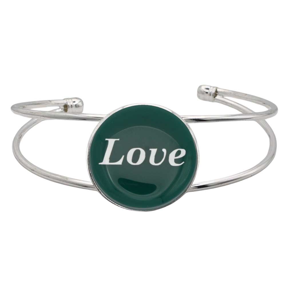 A silver-toned metal cuff bracelet featuring a round green disc with the word 'Love' printed in white script, shown on a plain white background – Lilylin Designs