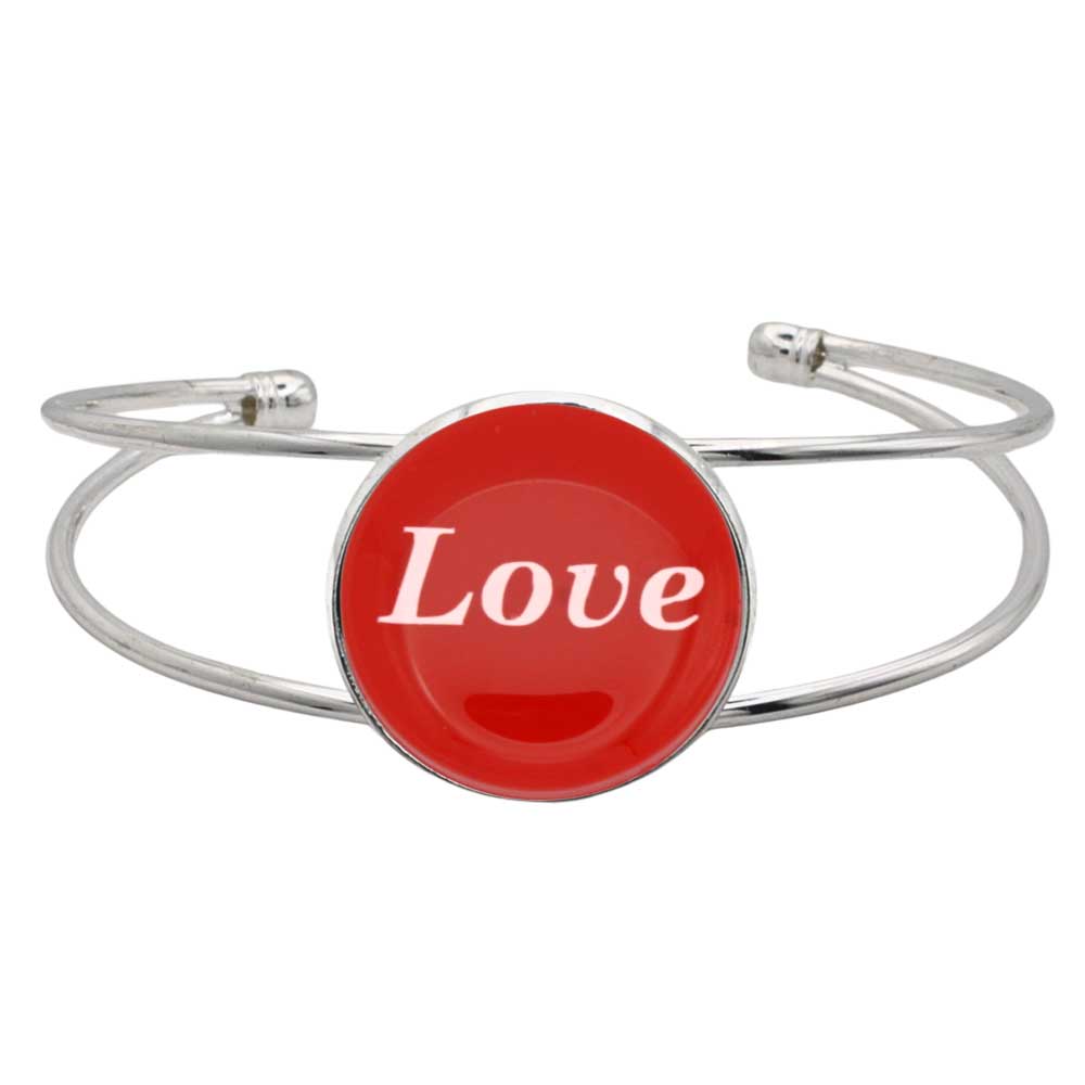 A silver-toned metal cuff bracelet featuring a round red disc with the word 'Love' printed in white script, shown on a plain white background – Lilylin Designs