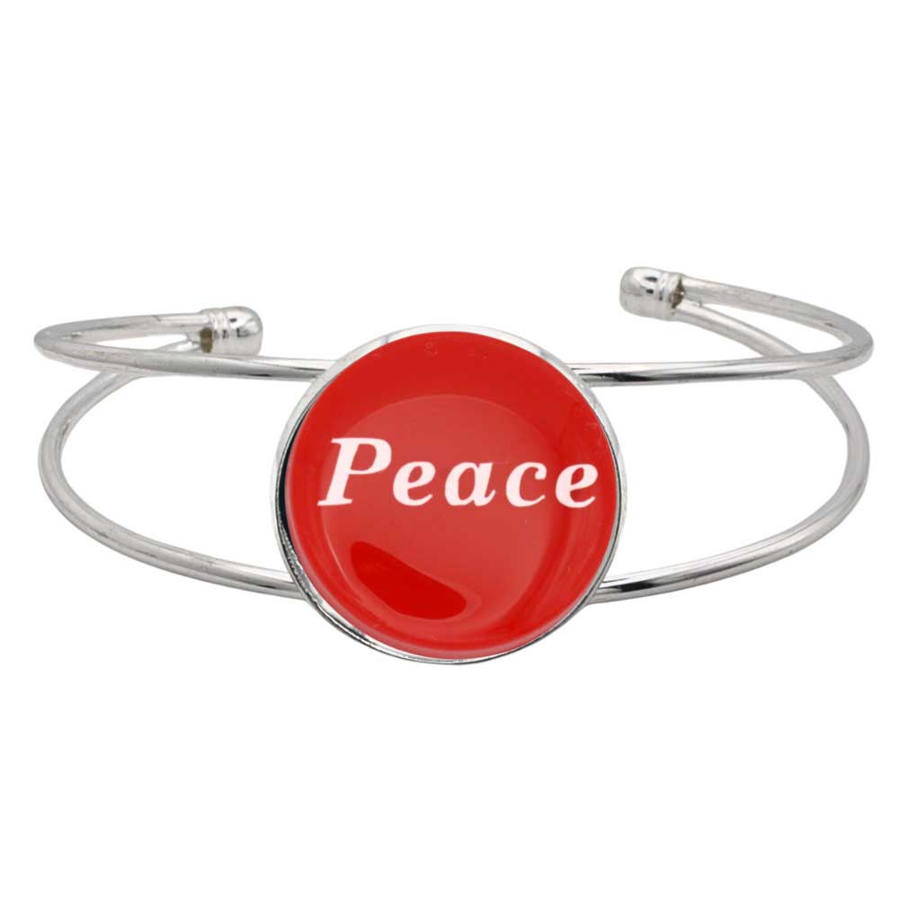 A silver-toned metal cuff bracelet featuring a round red disc with the word 'Peace' printed in white script, shown on a plain white background – Lilylin Designs