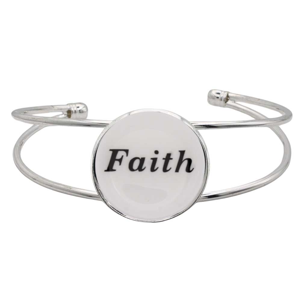 A silver-toned metal cuff bracelet featuring a round white disc with the word “Faith” printed in black script, shown on a plain white background – Lilylin Designs
